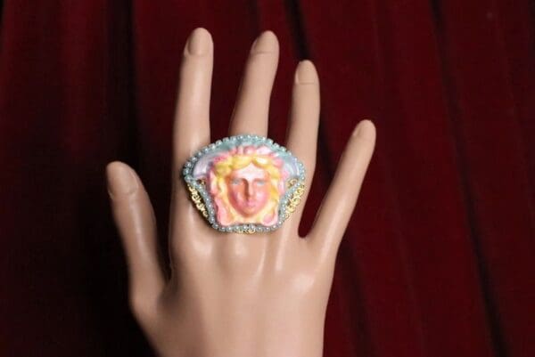 A hand with a ring on it's finger
