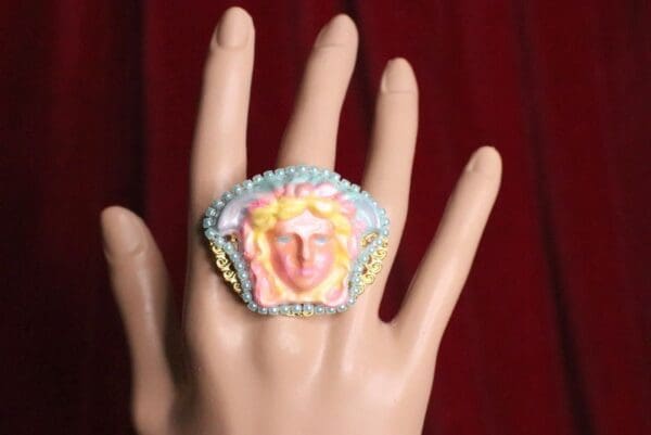 A hand with a ring on it's finger