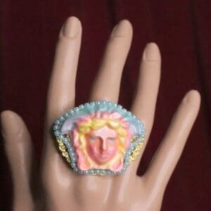 A hand with a ring on it's finger