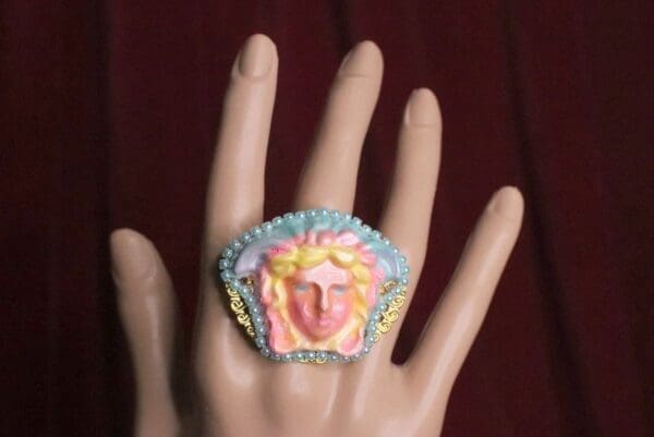 A hand with a ring on it's finger