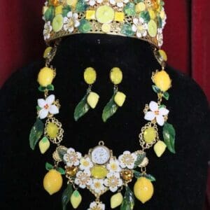 A woman wearing a necklace, earrings and a crown.