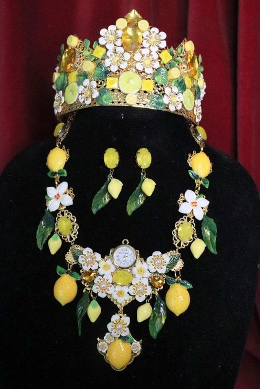 A woman wearing a necklace, earrings and a crown.