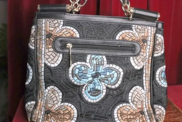 A close up of the front of a purse