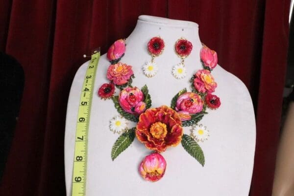 A necklace and earrings set made of paper.