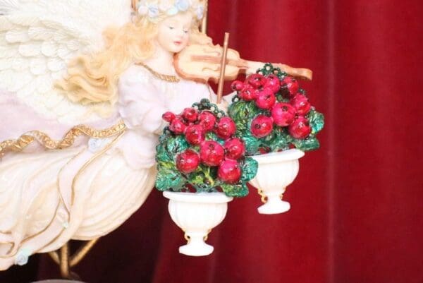 A close up of two vases with flowers