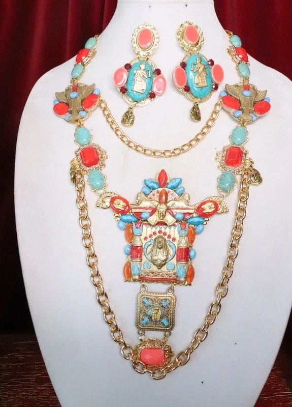 A necklace and earrings set with colorful stones.