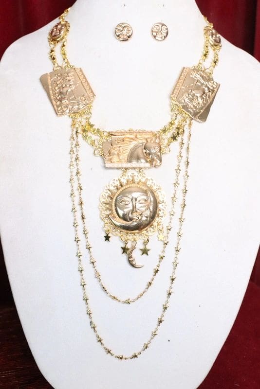 A necklace with multiple chains and a medallion.