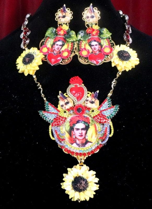 A necklace and earrings set with frida kahlo on it.