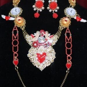 A necklace and earrings set with red, white and gold beads.