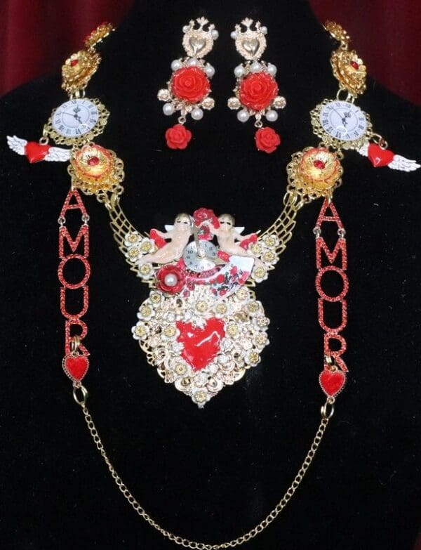 A necklace and earrings set with red, white and gold beads.