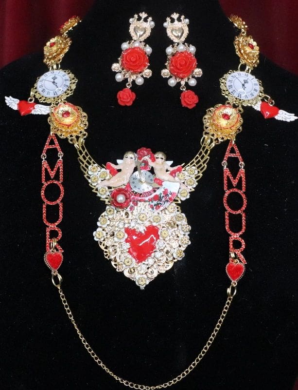 A necklace and earrings set with red, white and gold beads.