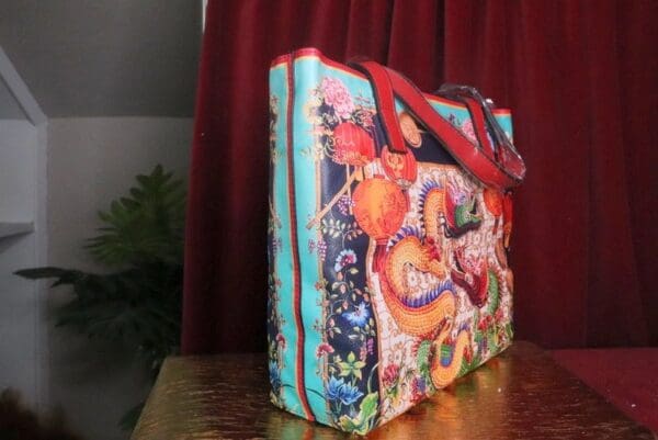 A bag with a picture of a dragon on it.