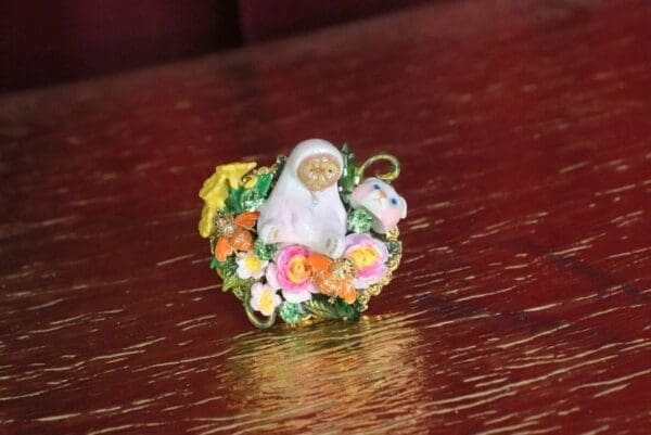 A small ceramic figurine sitting on top of a table.