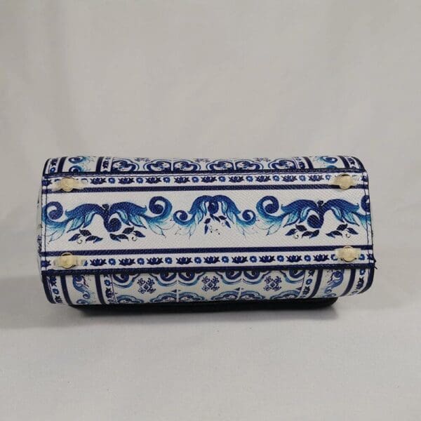 A blue and white purse with an elephant design.