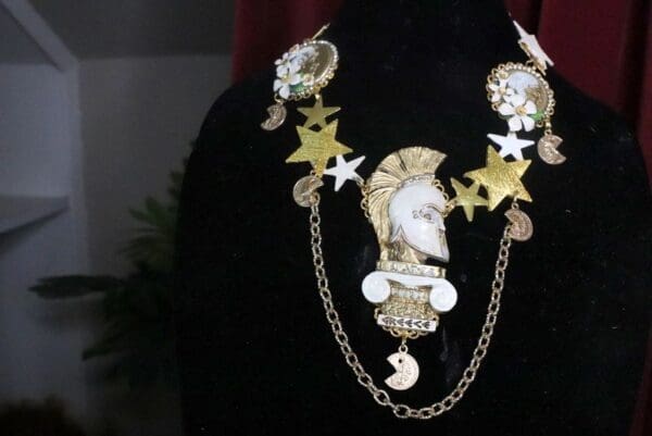 A black shirt with a chain and stars around it.