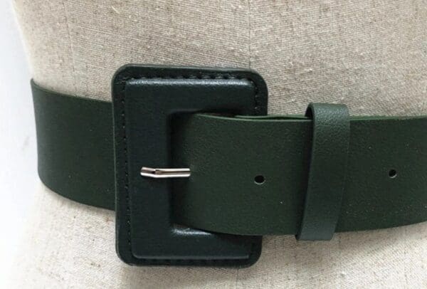 A close up of the buckle on a belt