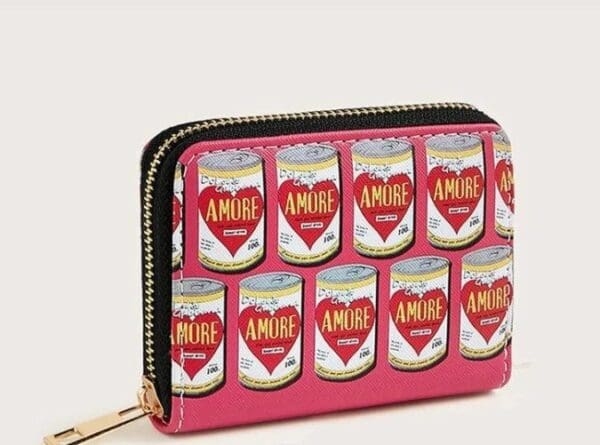 A pink wallet with many cans of soup on it