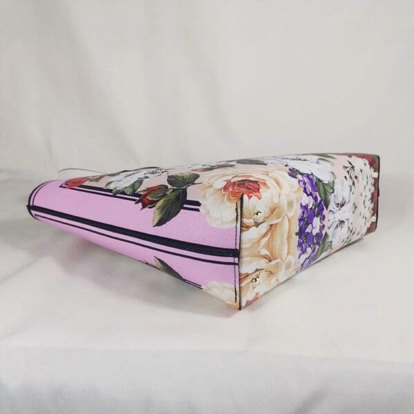 A pink bag with flowers on it