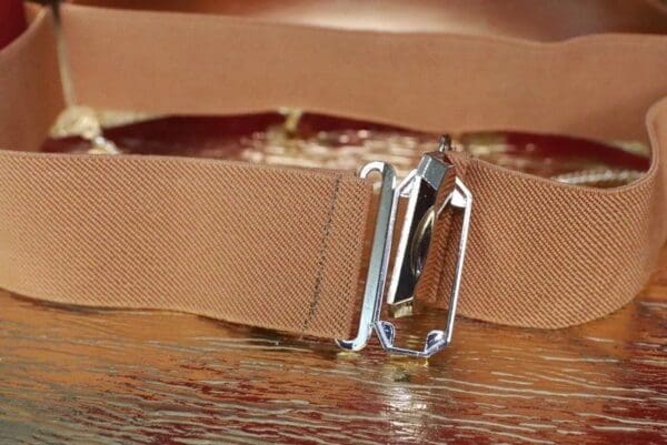 A close up of the buckle on a belt