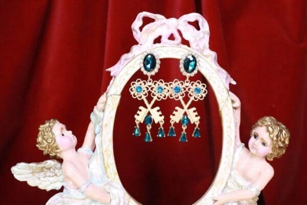 A mirror with some earrings hanging on it