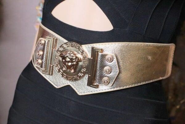 A close up of the belt on someone 's arm.