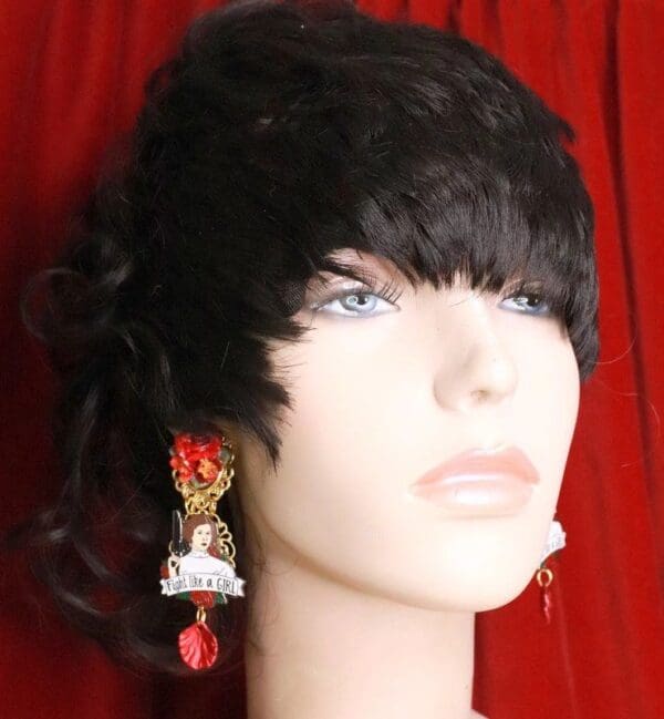 A woman wearing a black wig and earrings.