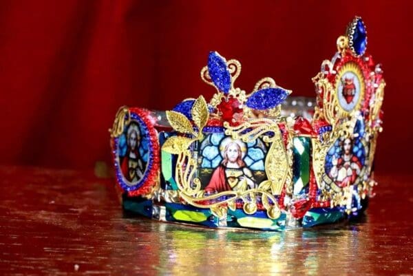 A colorful crown with many different designs on it.