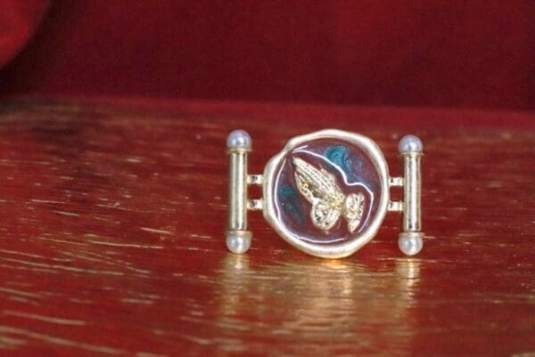 A close up of a ring on top of a table