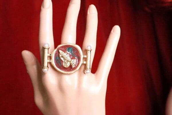 A hand with a ring on it's finger