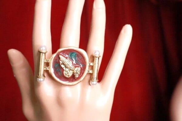 A hand with a ring on it