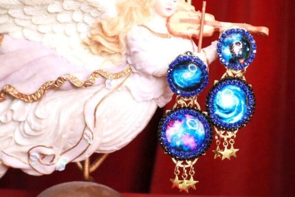A close up of some earrings with stars