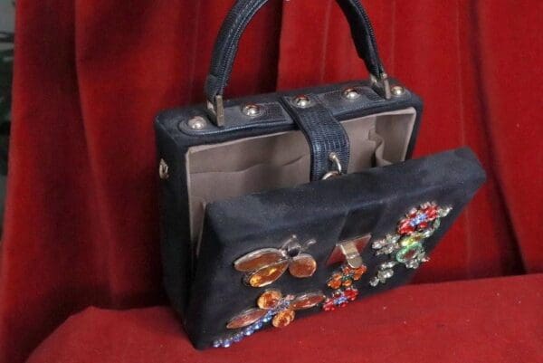 A black purse with some stickers on it