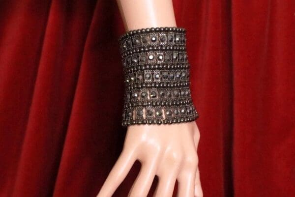 A close up of the wrist of a woman wearing a bracelet