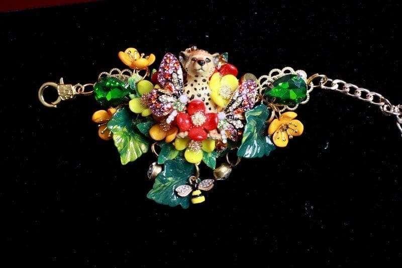 A close up of the necklace on a black background