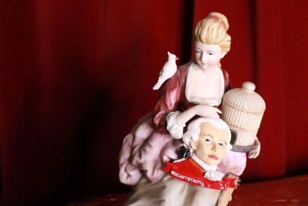 A couple of figurines are sitting on top of each other