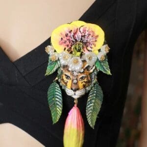 A close up of the necklace on a woman 's shoulder.
