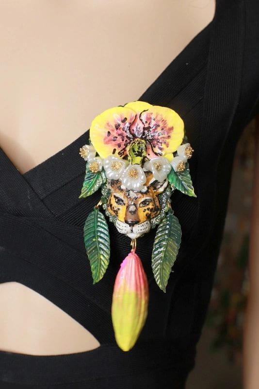 A close up of the necklace on a woman 's shoulder.