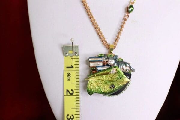 A necklace with a measuring tape and ruler