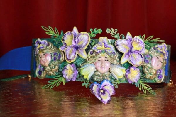 A close up of a flower decorated headband