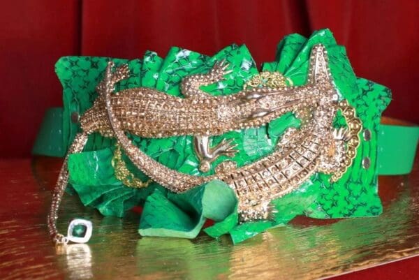 A group of lizards are sitting on some green paper.