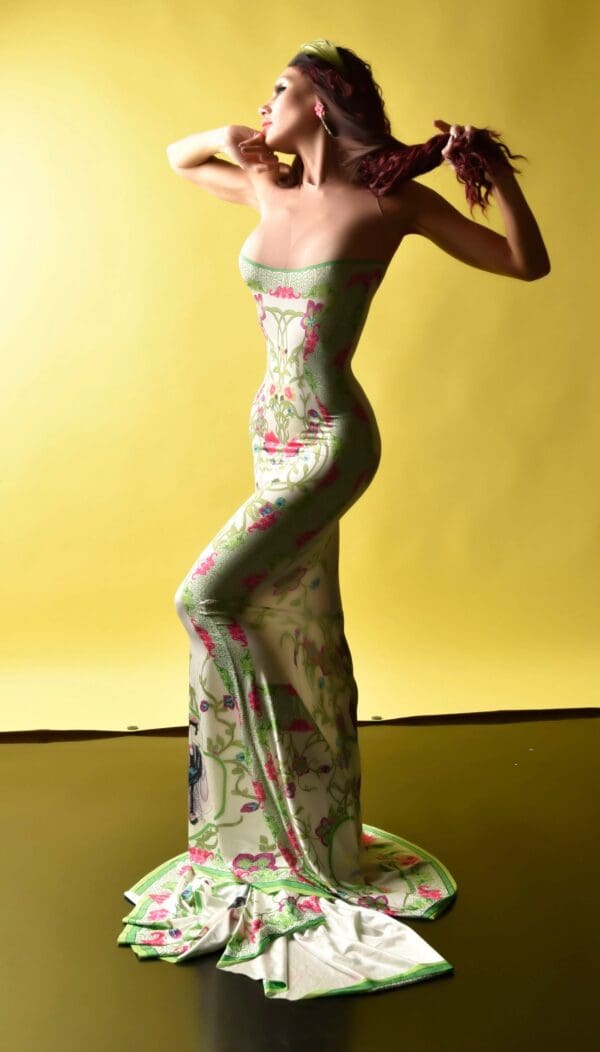 A woman in a long dress is standing up