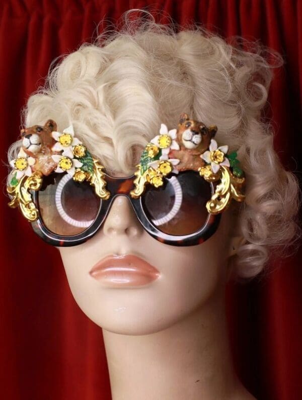 A mannequin wearing sunglasses with flowers on them.