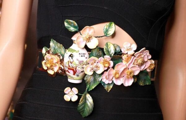 A close up of a flower arrangement on the wall