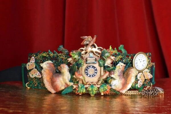 A clock with some animals and plants on it