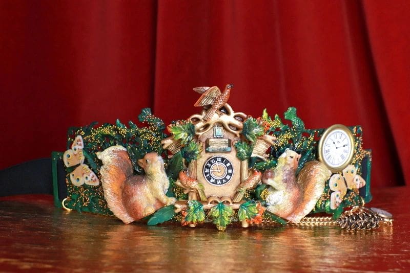 A clock with some animals and plants on it