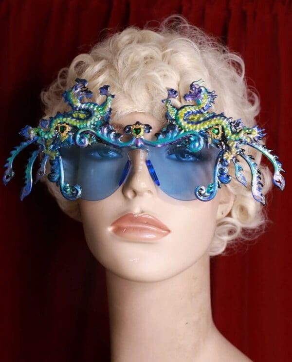 A mannequin wearing blue glasses with sea creatures on them.