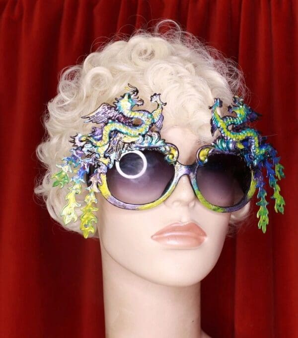 A mannequin wearing sunglasses with colorful flowers on them.