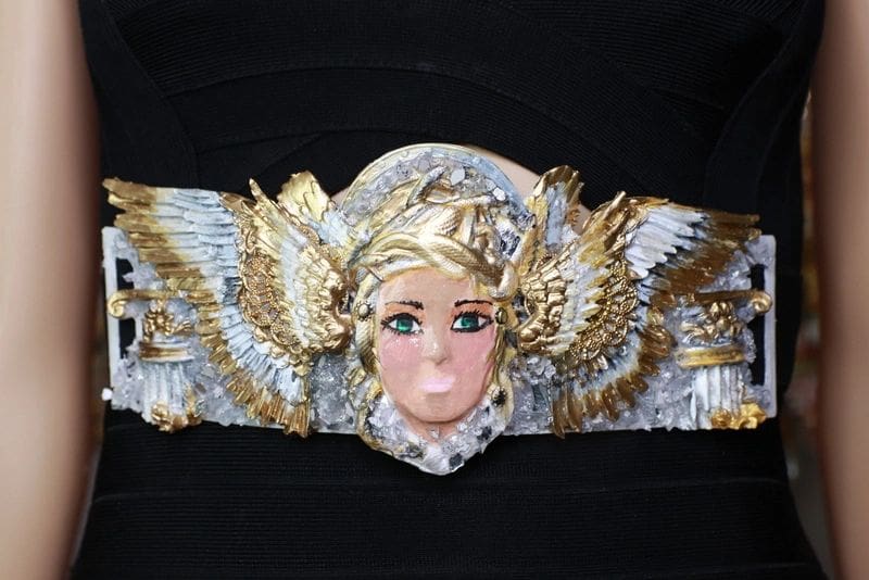 A close up of the head of a doll