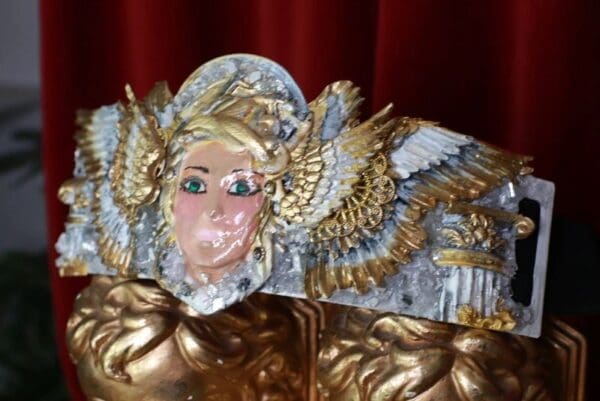 A close up of the head of a statue