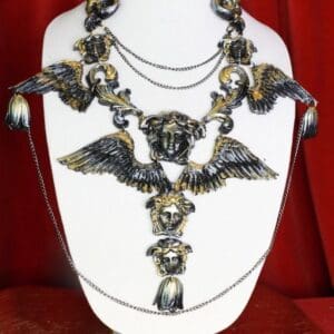 A necklace with many different designs on it